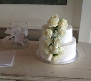 Small two tier wedding cake with white flowers