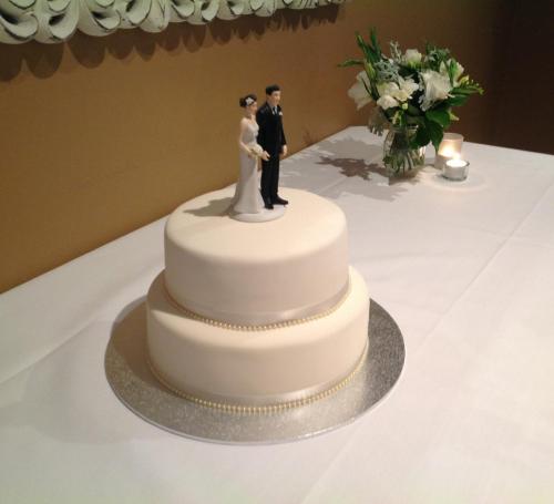 Fondant 2 tier satin ribbon and pearls formal Wedding Cake.