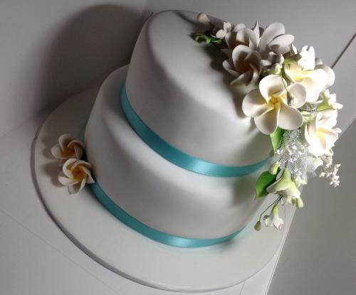 Fondant 2 tier sugar frangipani flowers Wedding Cake.