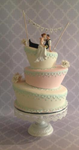 Fondant 3 tier "Onky Wonky" Wedding cake with fondant icing patterned decorations.