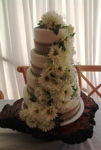 Fondant lace and hessian ribbon, green beads, mix of fresh and artificial flowers Wedding Cake.