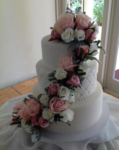 Fondant 3 tier artificial flowers centre tier quilted with edible pearls Wedding Cake.