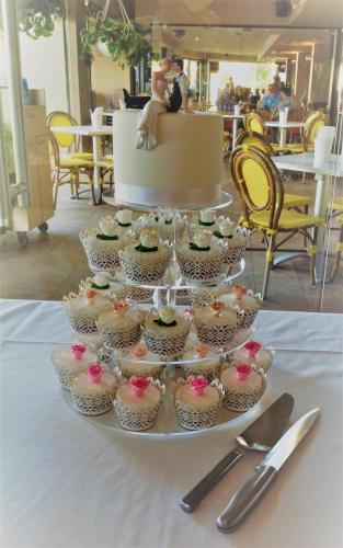 Fondant cutting cake and matching cupcakes with sugar flower toppers Wedding
